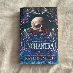 Enchantra by Kaylie Smith — Dark Fantasy Paperback with Skull & Roses Cover